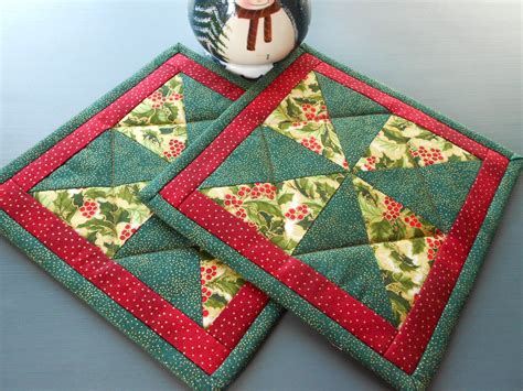 Christmas Fabrics Quilted Pot Holders Pinwheel Pattern/Set of two with colors of red, green and ...