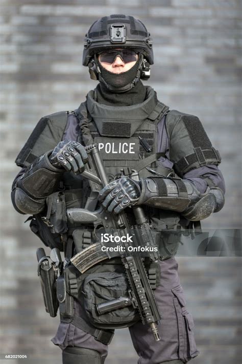 Swat Police Officer Against Brick Wall Stock Photo - Download Image Now - Police Force, SWAT ...