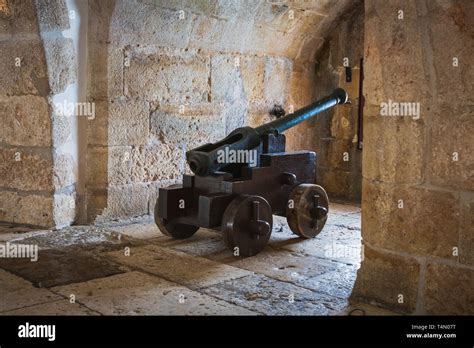 Historical cannon in a defense tower pointing out of a windows Stock ...