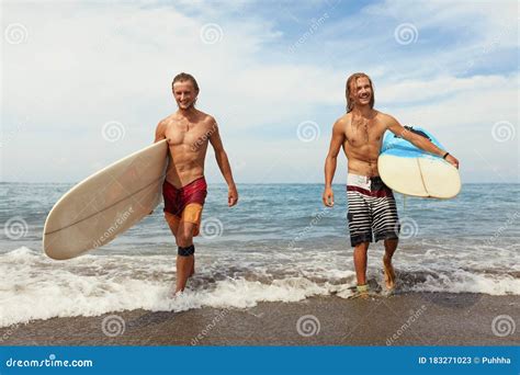 Surfing. Cheerful Young Surfers with Surfboards. Handsome Men Walking ...