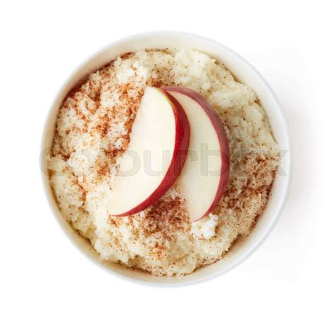 Bowl of rice flakes porridge isolated on white, from above | Stock image | Colourbox