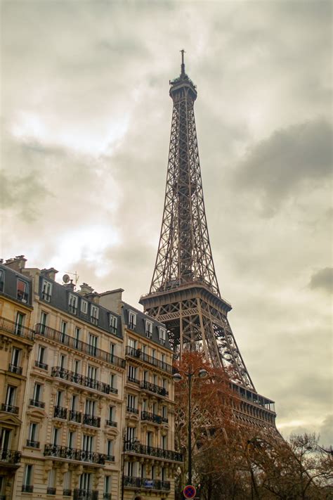 Photo of the Eiffel Tower Near Buildings · Free Stock Photo