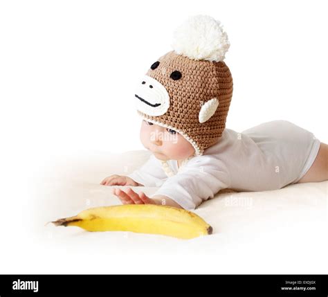 Baby in monkey hat Stock Photo - Alamy