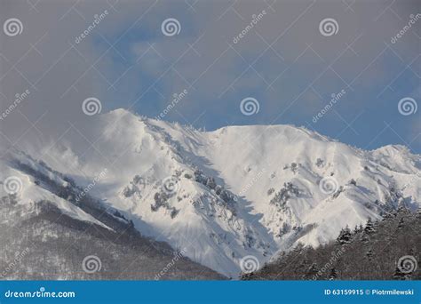 Snowy mountains in winter stock image. Image of seasonal - 63159915