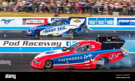 Top Fuel funny car drag racing at Santa Pod Raceway. Kevin Chapman Ford Mustang nearside V Kevin ...