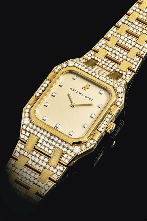 AUDEMARS PIGUET. AN 18K GOLD AND DIAMOND-SET BRACELET WATCH