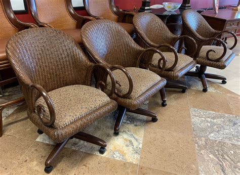 Set of 4 swivel dinette chairs on wheels. These comfortable rattan and cane chairs are easy to ...