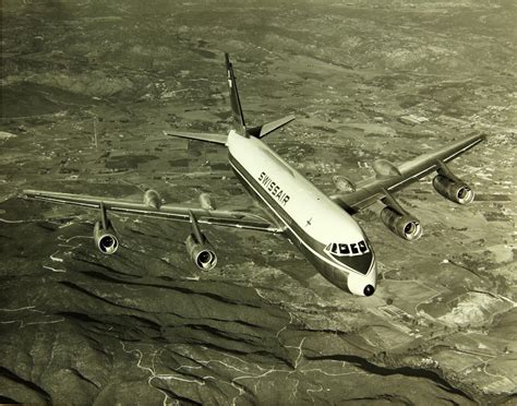 At Convair 990 of Swissair cruises at Mach .92 over Europe | Air and space museum, Vintage ...