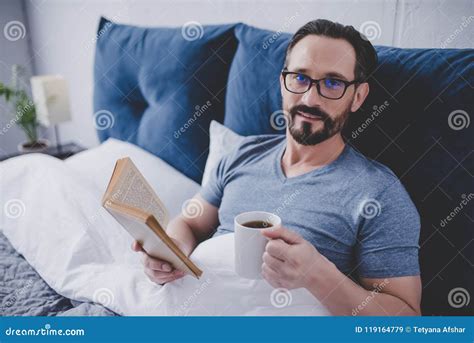 Man reading book in bed stock image. Image of blanket - 119164779