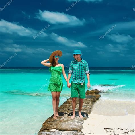 Couple on a beach at Maldives Stock Photo by ©haveseen 61769589