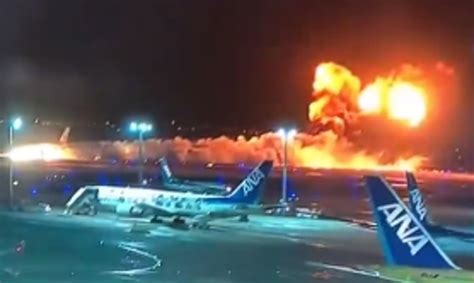 Japan Airlines plane with 367 passengers onboard catches fire on runway after colliding with ...