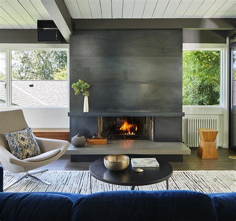 A Blackened Steel Fireplace Surround With A Concrete Hearth Is A Strong Look Inside This Mid ...