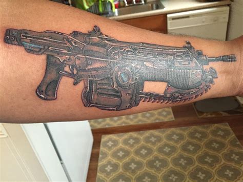 My first tattoo. Gears of War Chainsaw lancer done by Jason at Intricate Decor Mt Pleasant MI ...