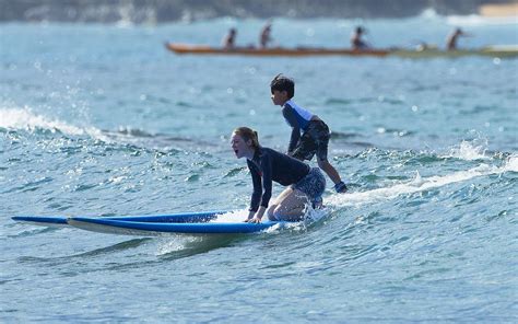 Emma Stone Surfing Photos: 2014 in Hawaii -09 | GotCeleb