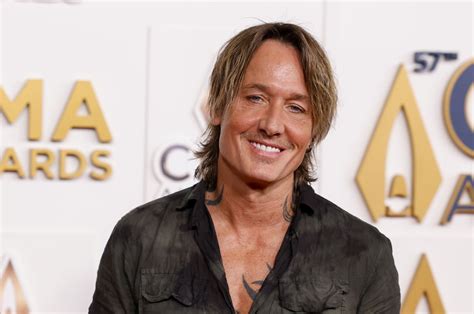 Watch: Keith Urban, Snoop Dogg sing about new 'Garfield Movie' - UPI.com