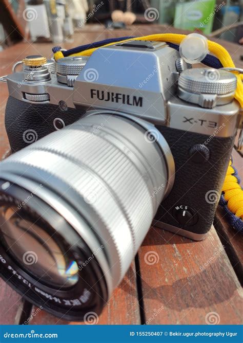 Vintage Silver and Black Fujifilm Camera with Brown Leather Strap on ...