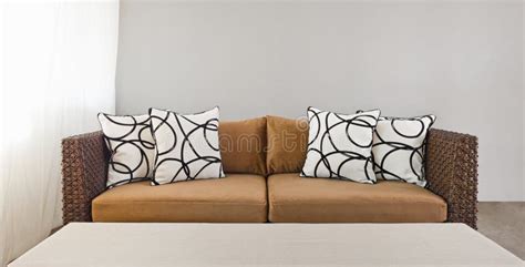 Beige sofa with pillows stock image. Image of design - 38229023