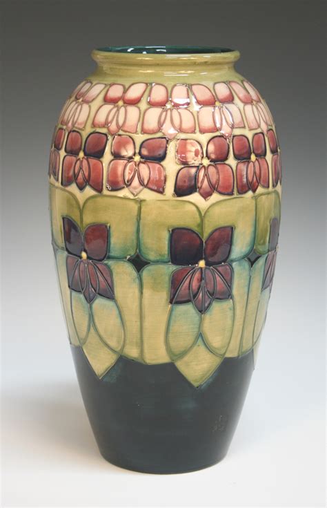 A large Moorcroft pottery vase, circa 1991, decorated with the Violet ...