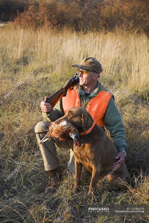 Bird hunter and his trained dog — Full Length, retriever - Stock Photo ...