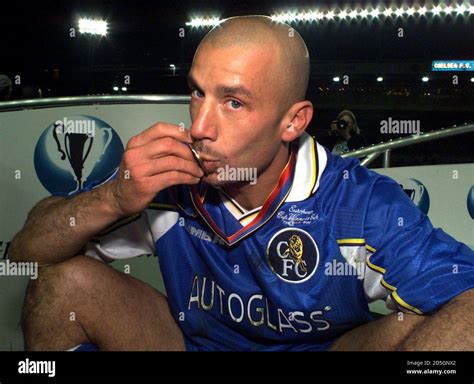 Chelsea manager gianluca vialli kisses his winners medal hi-res stock ...