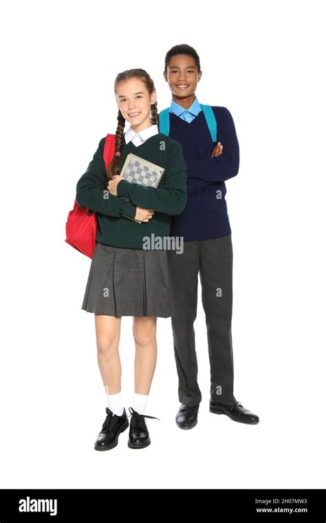 Teenagers in stylish school uniform on white background Stock Photo - Alamy