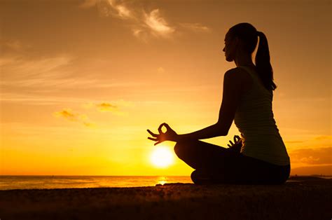 Woman Meditating By The Beach Stock Photo - Download Image Now - iStock