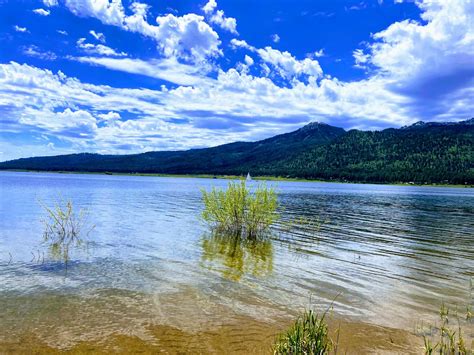 Free stock photo of blue mountains, clear blue sky, lake