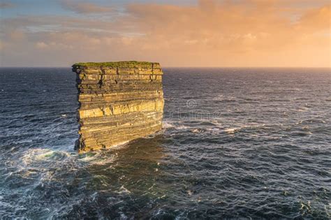 Downpatrick Head Sea Stack Illuminated by Sunrise, Standing in Atlantic Ocean, Ireland Stock ...