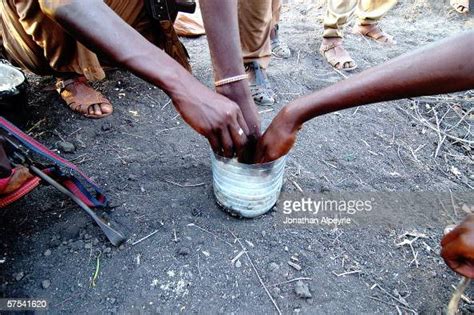 Three OLF members are eating rice out of a plastic bowl, February 4... News Photo - Getty Images