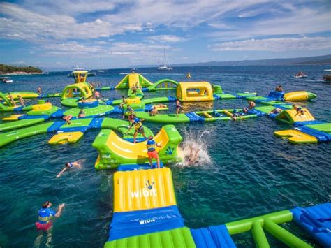 Jump on these floating water parks across Michigan