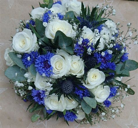 White rose, thistle, cornflower, gypsophila and eucalyptus bridal ...