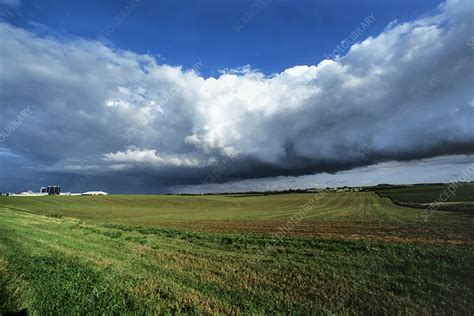 Cold front storm clouds over fields - Stock Image - C002/0101 - Science Photo Library