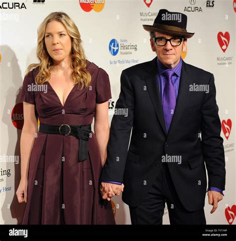 Singer Diana Krall and her husband, musician Elvis Costello arrive at the 2011 MusiCares Person ...