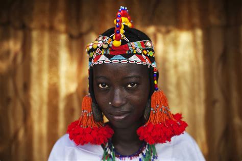 Balkissa Maiga wears a traditional Songhai headdress made by artisan ...