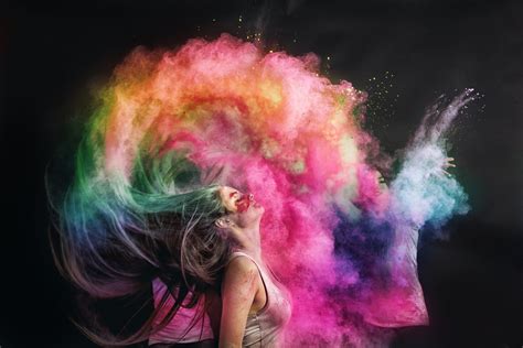 Woman splashing hair with holi powder - Plazabridge Group, LLC