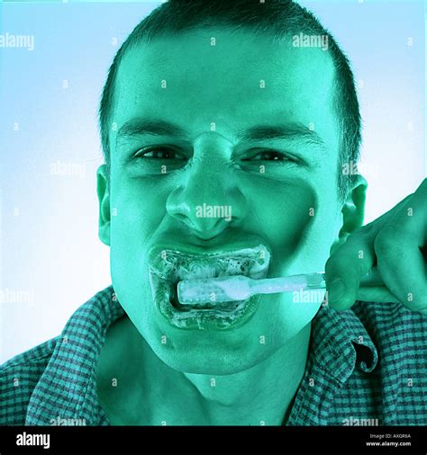 Man brushing his teeth Stock Photo - Alamy