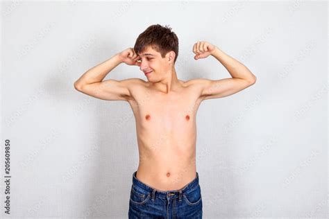 Weak Young Man Muscle Flexing Stock Photo | Adobe Stock