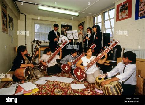 A school music class using Indian instruments including sitars Stock Photo: 21688660 - Alamy