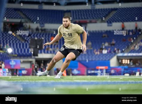 Kansas offensive lineman Dominick Puni runs a drill at the NFL football ...