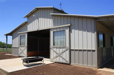 This barn is a 36' x 24' Raised Center Aisle with (3) 12' x 12' stalls and (1) tack room with ...