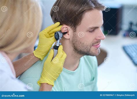 Tranquil Cute Man Undergoing an Otoscopy Procedure at a Clinic Stock ...