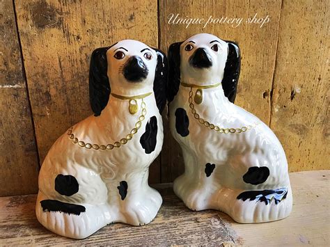 A great pair of English antique dog figurines by uniquepotteryshop on Etsy