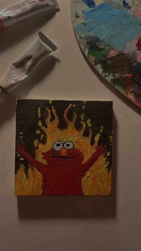 Elmo Painting on Fire