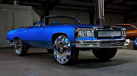 Blue Chevy Donk Convertible with A Custom Chrome Grill on 30 inch Floaters - Big Rims - Custom ...