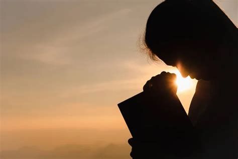 Silhouette of christian young woman praying with holy bible at sunrise, Christian Religion ...