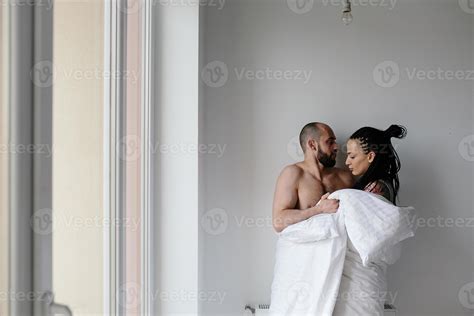 man and woman in the bedroom 11532084 Stock Photo at Vecteezy