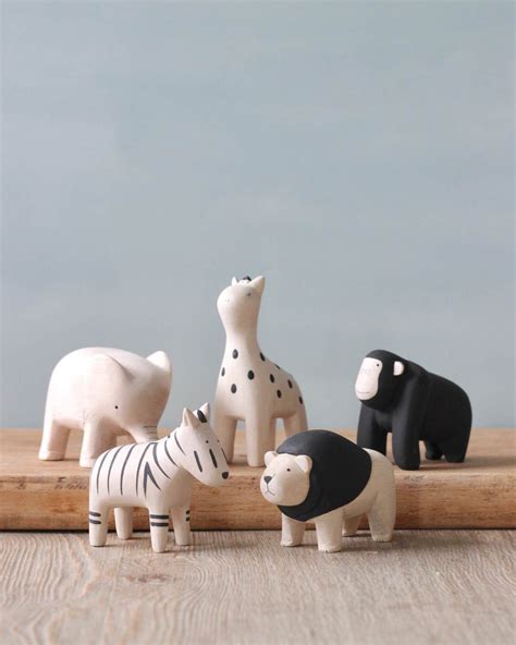 Each animal is hand carved from a soft light wood and then hand-painted with the sweetest ...