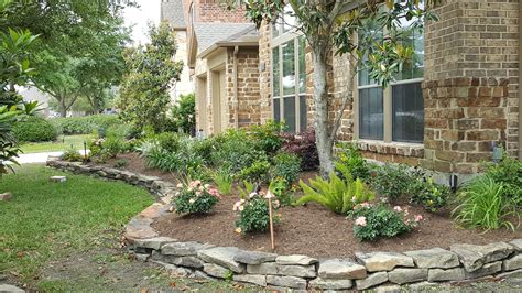 Classic Houston area raised flowerbed edged with stacked stone | Stone landscaping, Stone flower ...