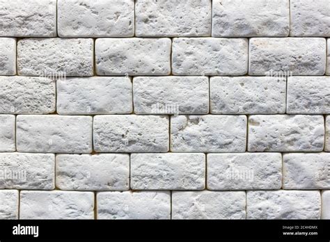 Seamless texture of white decorative stacked stone, natural stone cladding. brick background ...