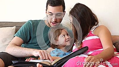 Family Reading the Bible Together Stock Video - Video of looking, education: 76030755